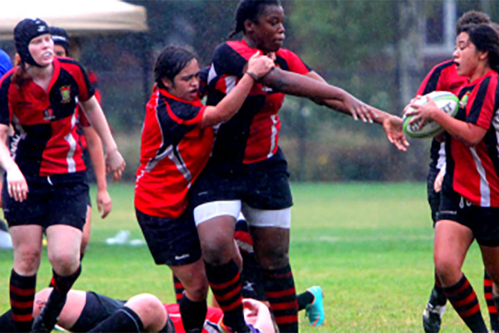 Women playing rugby