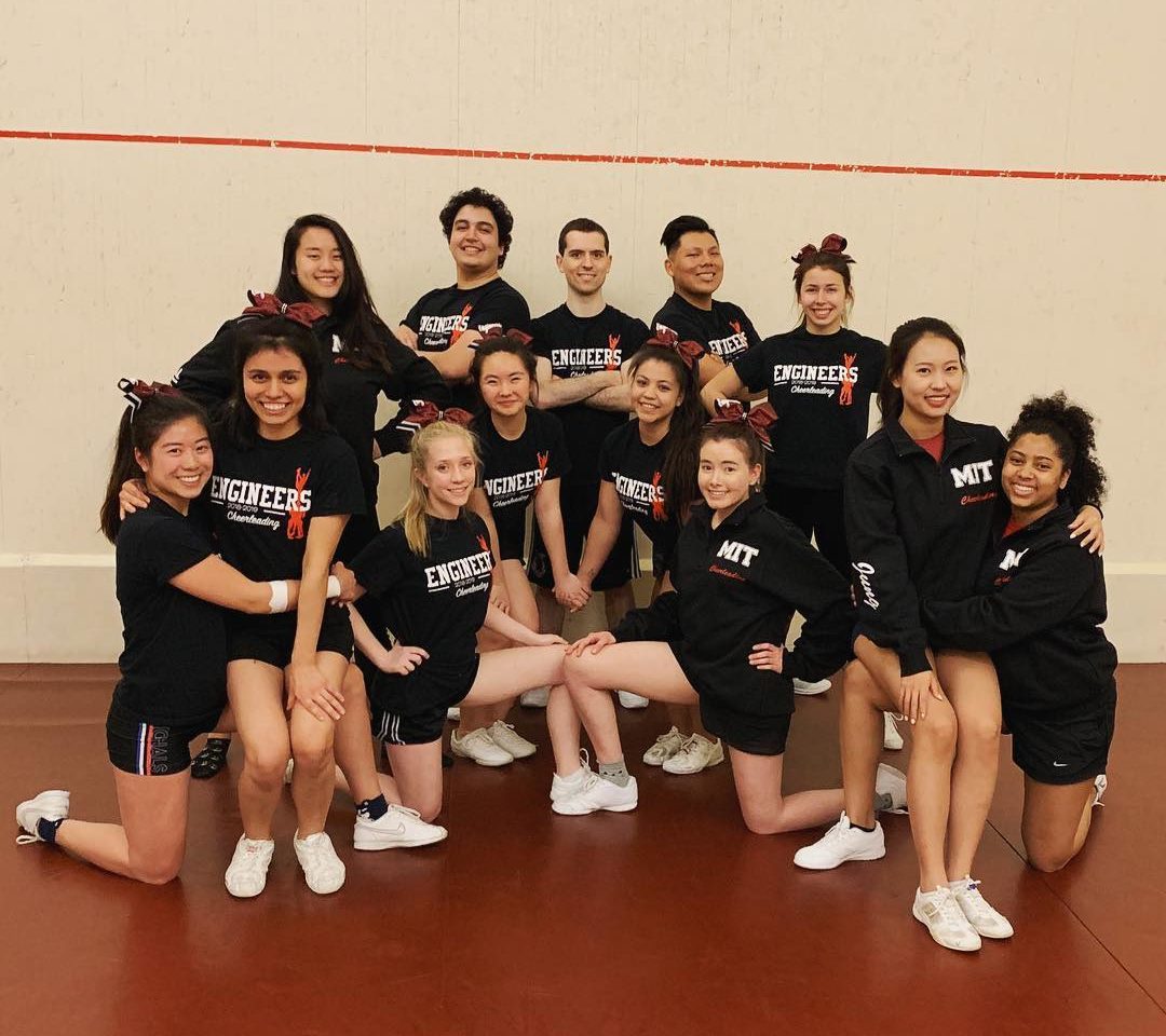 Cheerleaders kneeling for pose