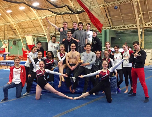 Gymnastics students posing with alumni